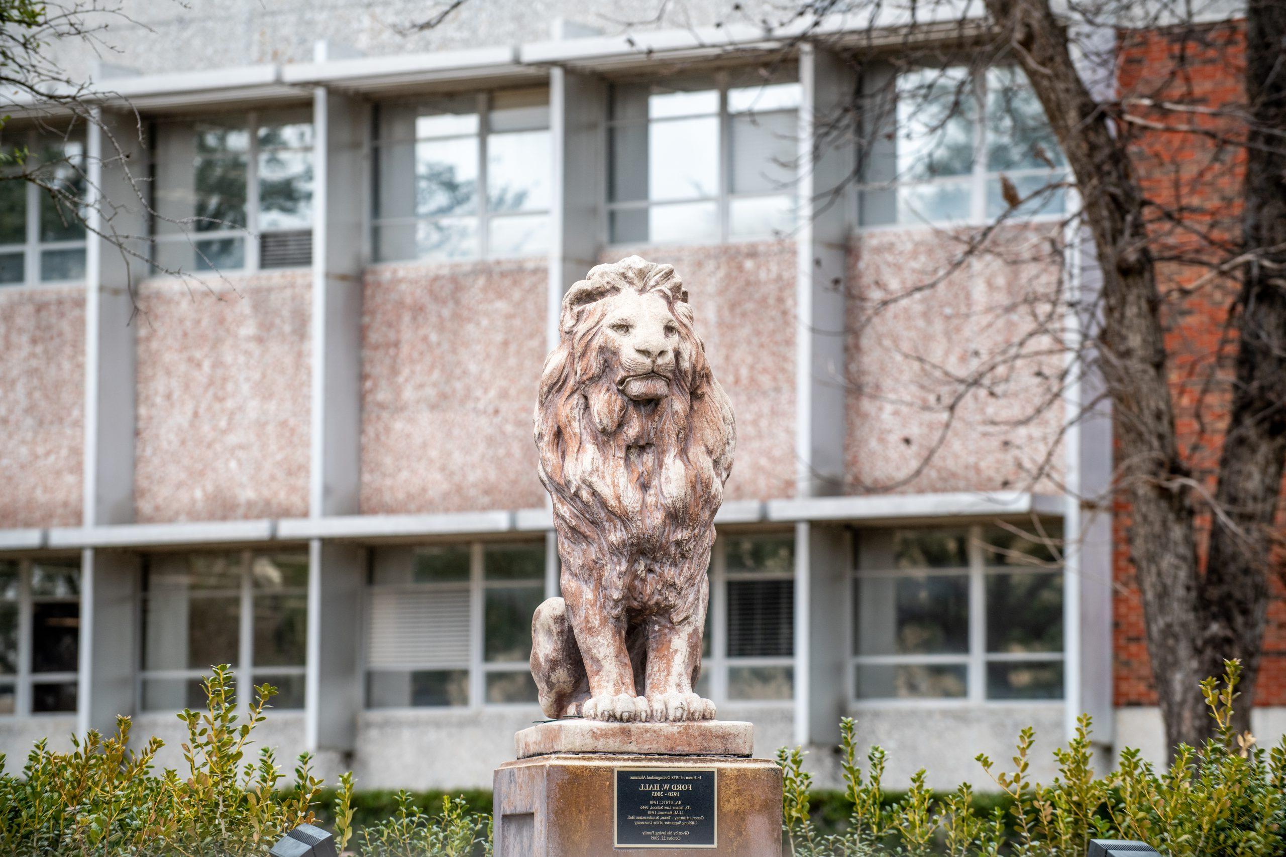 The lion statue in front of the library building.